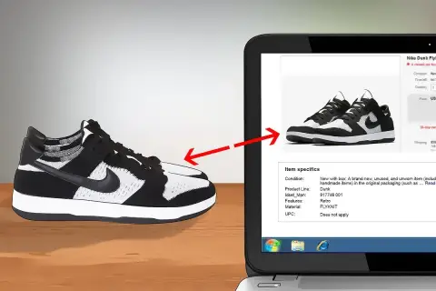 Schwarze und weiße Nike Dunk Flyknit Sneaker werden auf einem Laptop-Bildschirm gezeigt, um das Nike Modell herausfinden.