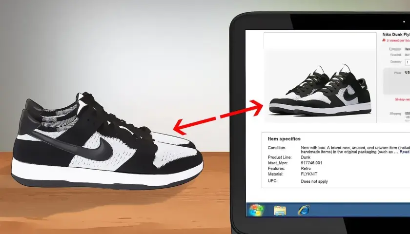 Schwarze und weiße Nike Dunk Flyknit Sneaker werden auf einem Laptop-Bildschirm gezeigt, um das Nike Modell herausfinden.