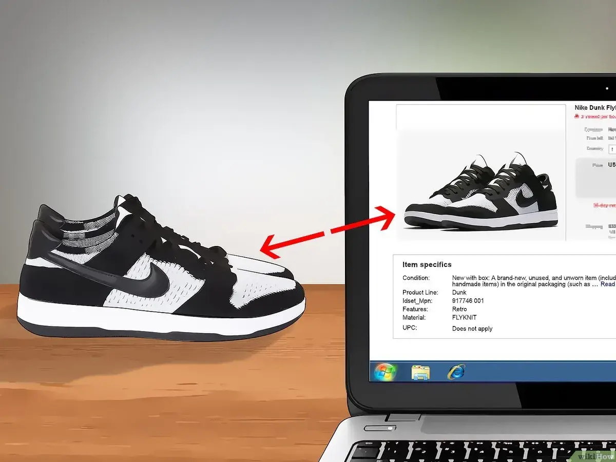 Schwarze und weiße Nike Dunk Flyknit Sneaker werden auf einem Laptop-Bildschirm gezeigt, um das Nike Modell herausfinden.
